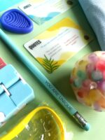 A table with some school supplies and a pencil