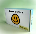 A box with the words " share a smile ".